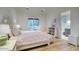 Inviting bedroom with hardwood floors, a cozy bed, and a view into the adjoining bathroom at 18916 N 98Th St # 3709, Scottsdale, AZ 85255