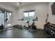 Well-equipped exercise room with modern equipment, including a treadmill, bike, and weight station at 18916 N 98Th St # 3709, Scottsdale, AZ 85255