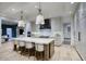 Bright kitchen showcasing a center island with bar stools, modern appliances, and ample storage at 18916 N 98Th St # 3709, Scottsdale, AZ 85255