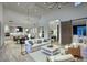 Open-concept living room with high ceilings, neutral tones, and seamless flow to the kitchen at 18916 N 98Th St # 3709, Scottsdale, AZ 85255
