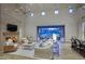 Bright and airy living room with fireplace and large sliding glass doors to the outdoor area at 18916 N 98Th St # 3709, Scottsdale, AZ 85255