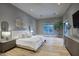Serene main bedroom with a king-size bed, neutral tones, and hardwood floors at 18916 N 98Th St # 3709, Scottsdale, AZ 85255