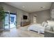 Spacious main bedroom with light hardwood flooring, modern decor, and an open door to a patio at 18916 N 98Th St # 3709, Scottsdale, AZ 85255