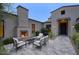 Cozy patio with an outdoor fireplace, comfortable seating, and brick-accented architecture at 18916 N 98Th St # 3709, Scottsdale, AZ 85255