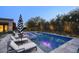 Sparkling pool surrounded by lush greenery, lounge chairs, and a serene atmosphere at 18916 N 98Th St # 3709, Scottsdale, AZ 85255