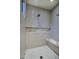 Walk-in shower with a built-in bench, marble accents, and subway tile walls at 18916 N 98Th St # 3709, Scottsdale, AZ 85255