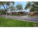 Street view of landscaped front yards featuring mature trees and colorful vegetation at 18916 N 98Th St # 3709, Scottsdale, AZ 85255