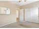 Comfortable bedroom with neutral colored walls, carpet flooring and double door closet at 21026 N Circle Cliffs Dr, Surprise, AZ 85387