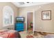 Bedroom featuring twin beds, bright windows, and en suite bath at 21026 N Circle Cliffs Dr, Surprise, AZ 85387