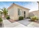 Light tan single-story home featuring desert landscaping, stucco walls, and tile roof at 21026 N Circle Cliffs Dr, Surprise, AZ 85387