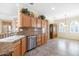 Open-concept kitchen with breakfast bar featuring granite countertops and stainless steel appliances at 21026 N Circle Cliffs Dr, Surprise, AZ 85387