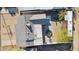 Aerial view of home, showcasing the backyard with drought tolerant landscaping, seating, and gravel at 2140 W Mitchell Dr, Phoenix, AZ 85015