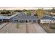 Aerial view of a single story home with desert landscaping, covered porch, and grey exterior at 2140 W Mitchell Dr, Phoenix, AZ 85015