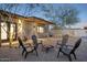 Backyard firepit seating, modern pergola, and unique outdoor design elements at 2140 W Mitchell Dr, Phoenix, AZ 85015