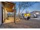 Relaxing backyard with a pergola, seating area, and well-lit landscaping at 2140 W Mitchell Dr, Phoenix, AZ 85015