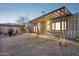 Backyard lounge area with stylish decor, hammock, and cozy outdoor ambiance at 2140 W Mitchell Dr, Phoenix, AZ 85015