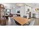 Open-concept dining area adjacent to a modern kitchen and cozy living space at 2140 W Mitchell Dr, Phoenix, AZ 85015