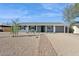 Charming single-story home with gray brick, desert landscaping, and a welcoming front porch at 2140 W Mitchell Dr, Phoenix, AZ 85015