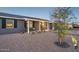 Single story home with desert landscaping, seating and covered front porch at 2140 W Mitchell Dr, Phoenix, AZ 85015