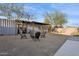 Unique container home with gravel landscaping, outdoor seating, and covered patio offering an alternative living experience at 2140 W Mitchell Dr, Phoenix, AZ 85015