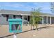 Charming home featuring a Little Free Library and low-maintenance desert landscaping at 2140 W Mitchell Dr, Phoenix, AZ 85015