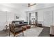 Bright and airy living room featuring stylish seating and decor at 2140 W Mitchell Dr, Phoenix, AZ 85015