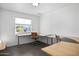 Bright office space featuring built-in desks, neutral colors, and a window with natural light at 2140 W Mitchell Dr, Phoenix, AZ 85015