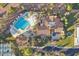 Overhead perspective of a community with tennis courts, pools, and lush landscaping, offering a resort-style atmosphere at 23108 N Pedregosa Dr, Sun City West, AZ 85375