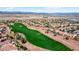 Aerial view of homes on a golf course, showcasing the community's layout and the nearby mountain views at 23108 N Pedregosa Dr, Sun City West, AZ 85375