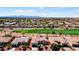 Aerial view showcasing a desert community with a golf course and mountains in the background at 23108 N Pedregosa Dr, Sun City West, AZ 85375