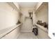 Large walk-in closet with neutral carpet and bright white shelving ready to be organized at 23108 N Pedregosa Dr, Sun City West, AZ 85375