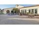 Clubhouse exterior with fountain, outdoor seating, and desert landscaping, offering a welcoming gathering space at 23108 N Pedregosa Dr, Sun City West, AZ 85375