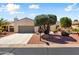 Attractive single-story home with a well-manicured front yard and a two-car garage at 23108 N Pedregosa Dr, Sun City West, AZ 85375