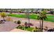 Scenic view of a golf course from a home featuring lush landscaping and desert surroundings at 23108 N Pedregosa Dr, Sun City West, AZ 85375