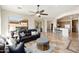 Bright living room with a large window, tile floors, and comfortable seating area at 23108 N Pedregosa Dr, Sun City West, AZ 85375