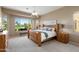 Comfortable main bedroom with golf course views and natural light at 23108 N Pedregosa Dr, Sun City West, AZ 85375