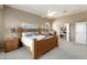Bright main bedroom with an en-suite bathroom and natural light at 23108 N Pedregosa Dr, Sun City West, AZ 85375