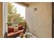 Cozy balcony with comfortable seating and a view of the surrounding greenery at 3330 S Gilbert Rd # 2090, Chandler, AZ 85286