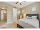 Bright bedroom featuring a bed, nightstands, and ensuite bathroom at 3330 S Gilbert Rd # 2090, Chandler, AZ 85286