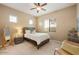 Comfortable bedroom with natural light, ceiling fan, and neutral tones at 3330 S Gilbert Rd # 2090, Chandler, AZ 85286