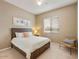 Cozy bedroom featuring a plush bed, neutral decor, and a bright window for natural light at 3330 S Gilbert Rd # 2090, Chandler, AZ 85286