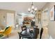 Cozy dining room with modern chandelier, seamlessly connected to kitchen at 3330 S Gilbert Rd # 2090, Chandler, AZ 85286