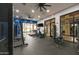 Community gym features treadmills, stationary bikes, and weight machines in a well-lit space with floor-to-ceiling windows at 3330 S Gilbert Rd # 2090, Chandler, AZ 85286