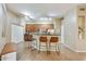 Open kitchen with stainless steel appliances, breakfast bar, and tile flooring at 3330 S Gilbert Rd # 2090, Chandler, AZ 85286