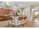 Kitchen with stainless appliances, granite counters, bar seating, and plenty of cabinet space at 3330 S Gilbert Rd # 2090, Chandler, AZ 85286