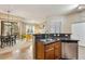 Open concept kitchen with stainless appliances, bar seating, seamlessly connecting to the living area at 3330 S Gilbert Rd # 2090, Chandler, AZ 85286