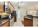 Kitchen featuring granite countertops, stainless steel appliances, and tiled flooring at 3330 S Gilbert Rd # 2090, Chandler, AZ 85286
