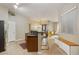 Open-concept kitchen with stainless appliances, bar seating, seamlessly connects to dining and living spaces at 3330 S Gilbert Rd # 2090, Chandler, AZ 85286