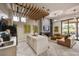 Open lounge area with island, leather sofa, fireplace, mounted tv, and modern lighting fixtures and decor at 3330 S Gilbert Rd # 2090, Chandler, AZ 85286