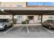 Assigned covered parking area with two cars and building facade in the background at 3330 S Gilbert Rd # 2090, Chandler, AZ 85286